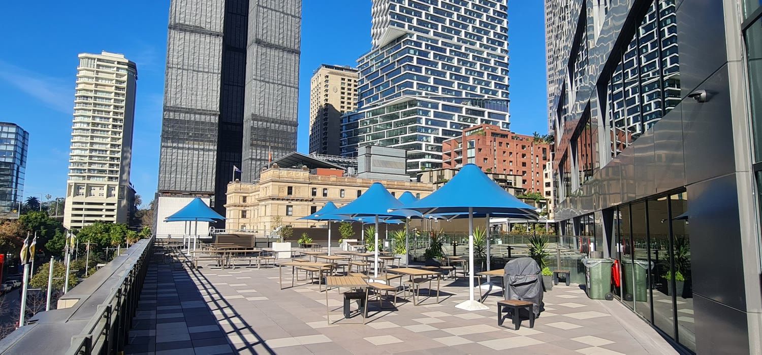 Commercial rooftop terrace with shade umbrellas